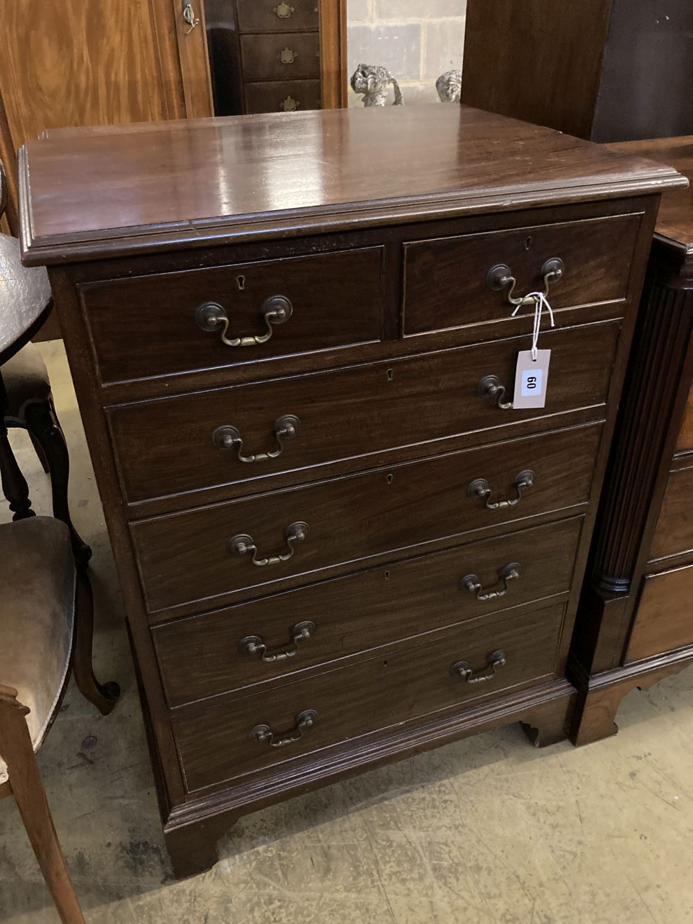 A small Edwardian George III style mahogany chest, bears Bartholomew & Fletcher label, width 66cm, depth 46cm, height 92cm